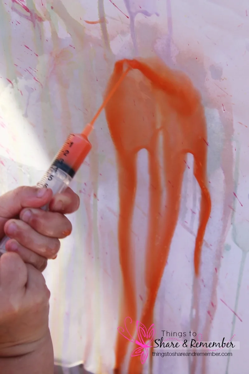 syring painting with orange
