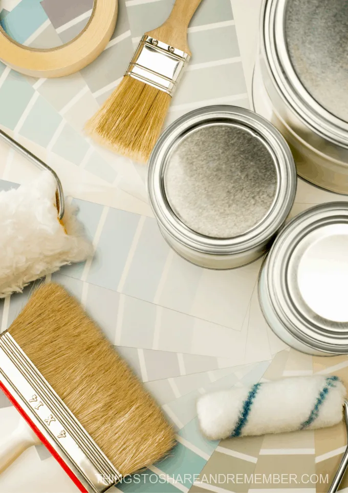 paint samples, paint cans and brushes for home updates