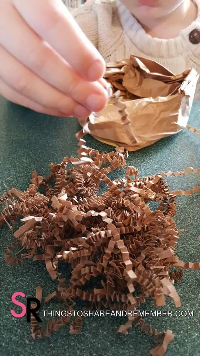 add crinkle paper to nest