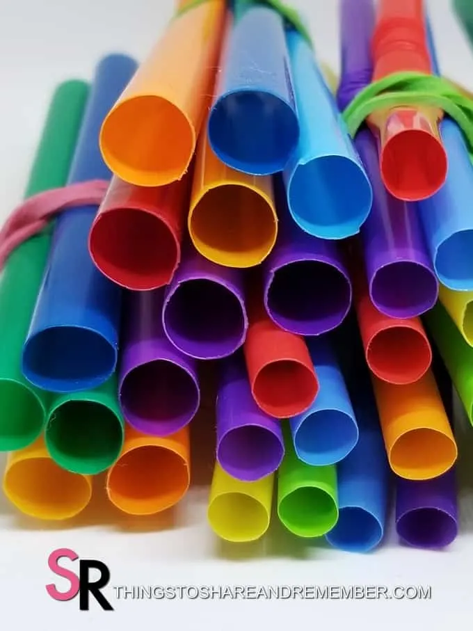 ends of colorful straws wrapped with rubber bands