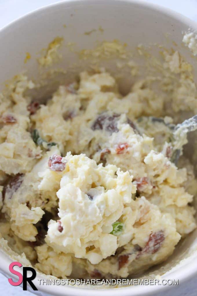 mixing potato salad ingredients