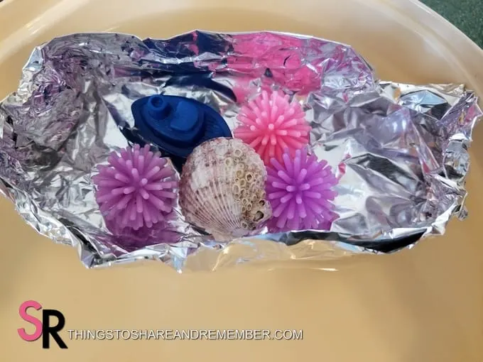 floating objects in tin foil boat