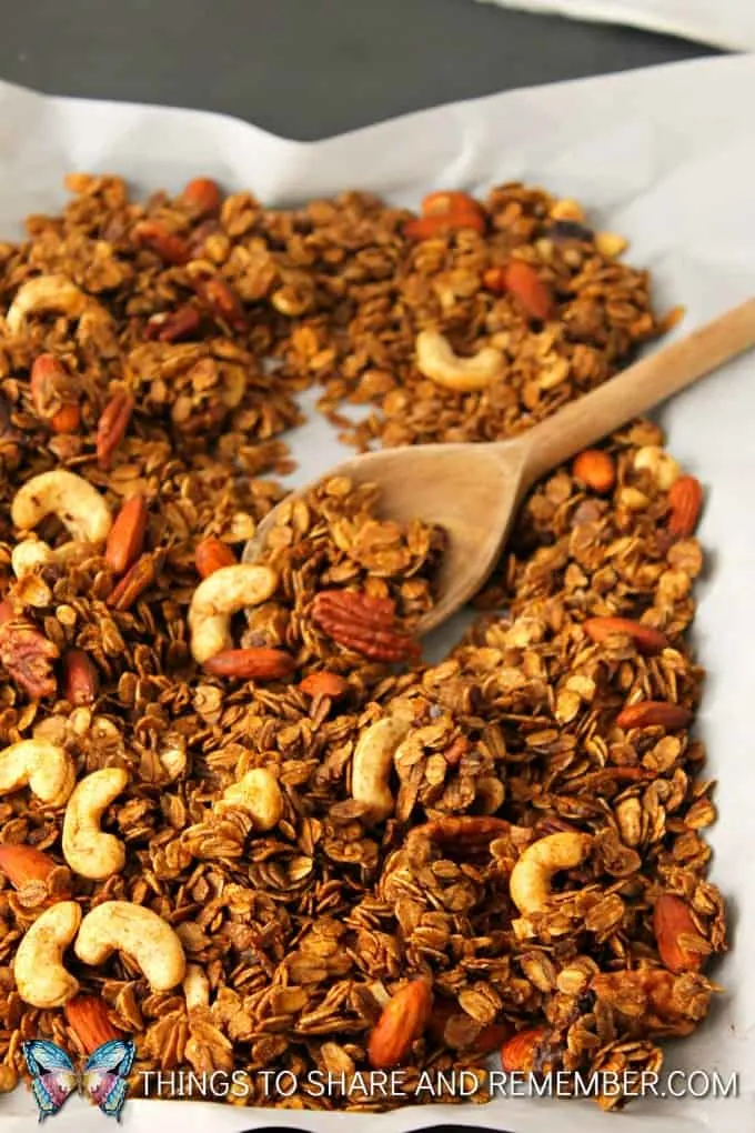 Gluten-Free Gingerbread Granola with a wood spoon
