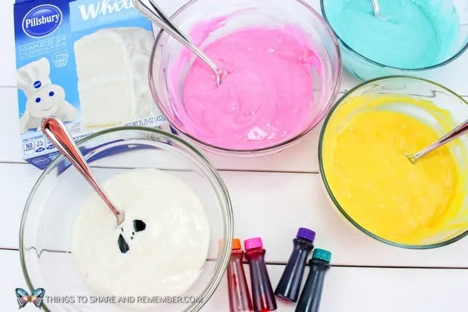 mixing cake batter and food coloring