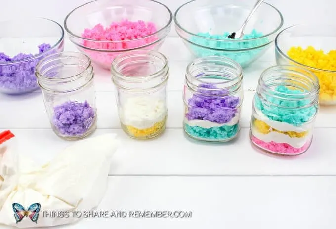 layering cake and frosting in jars