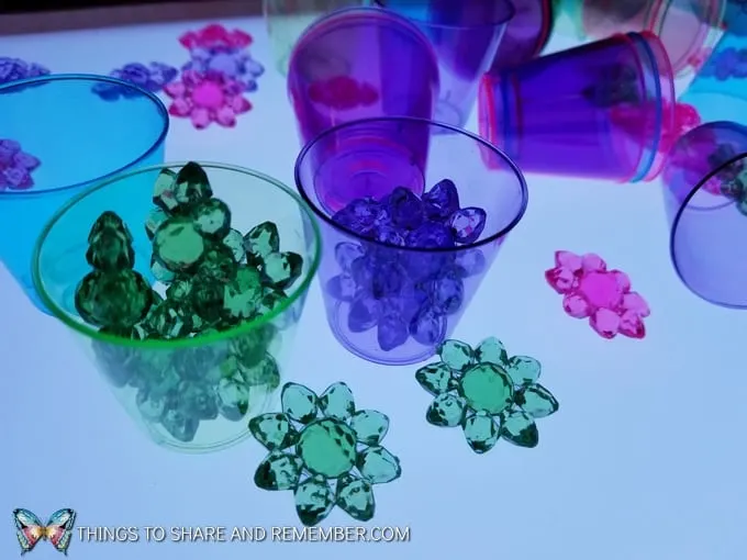 pastel flowers and cups on the light table