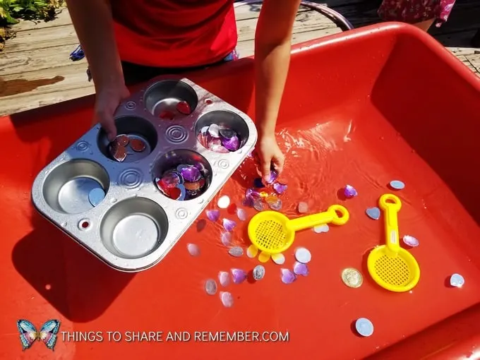 sorting water treasure into muffin tins preschool sensory play idea Gems and Jewels Sensory and Sorting Play Activities Preschool Activities