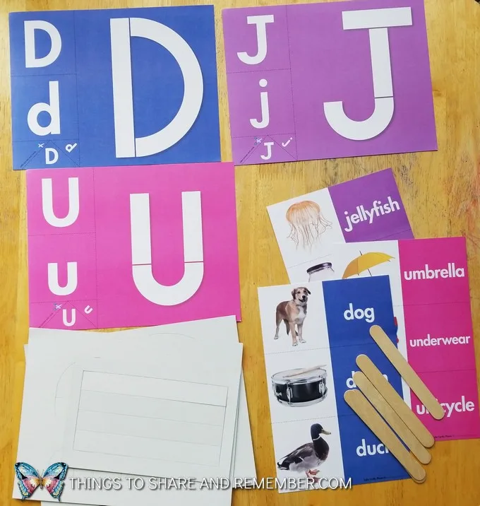 letters D, J, U loose parts letters pieces and alphabet cards