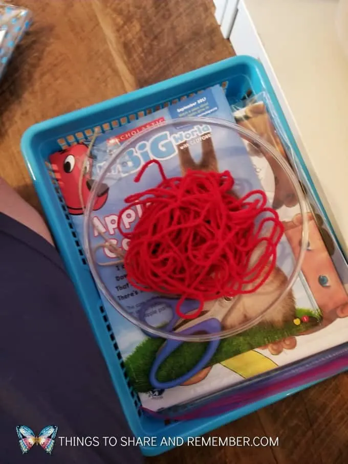 bowl with red yarn basket with Scholastic My Big World Clifford Magazines for super fun circle time