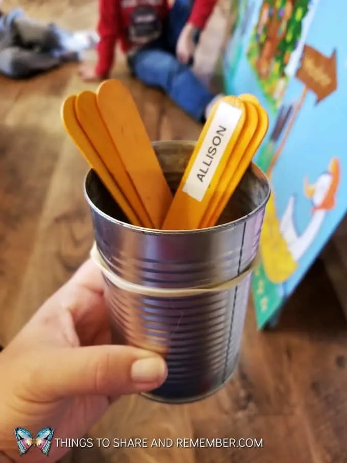 tin can with craft sticks with names on them for taking turns  super fun circle time