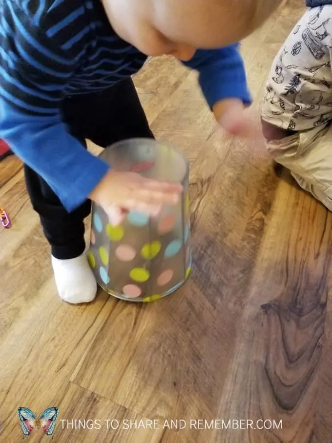Basket drum for toddler play and exploration of drums. What can you pound on or tap to make noise? #MGTblogger #MotherGooseTime #SightsandSounds