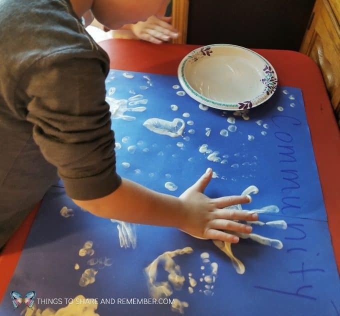 Community Challenge for preschool: making fingerprints or handprints group activity for preschool - goes with the theme Sights and Sounds of Winter from Mother Goose Time  #MGTblogger #MotherGooseTime #preschool #SightsandSounds 