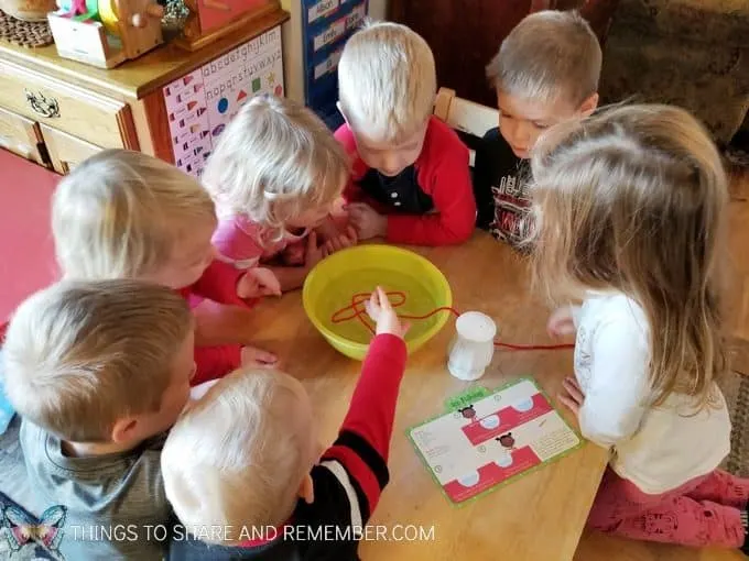 Preschool winter ice activities: ice fishing science experiment for preschoolers involving ice freezing and melting #SightsandSounds #MotherGooseTime #MGTblogger