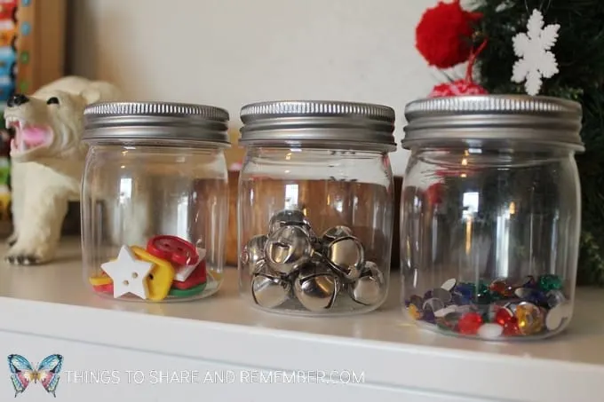 Small plastic jars with a variety of contents to experiment with shaking and hearing the sound. Can you shake it loud? Can you shake it quietly? #STEAM #preschoolSTEAM #STEAMStation #preschool #sensory #SightsandSounds #MGTblogger #MotherGooseTime