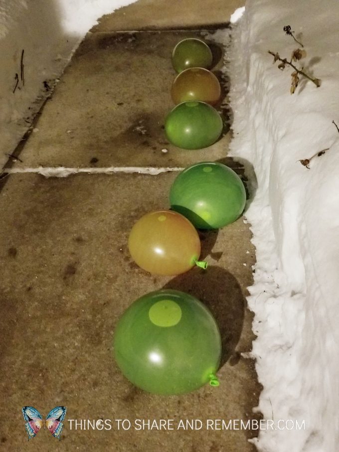 freezing water filled balloons to make Frozen Ice Gems Outdoor Winter Art