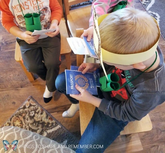 checking passports in dramtic play Going on Safari preschool theme binoculars craft and related activities for preschoolers #MGTBlogger #MotherGooseTime #preschool #preschoolcurriculum #GoingOnSafari #safaritheme