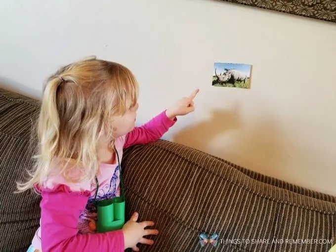 child looking at a rhinoceros Going on Safari preschool theme binoculars craft and related activities for preschoolers #MGTBlogger #MotherGooseTime #preschool #preschoolcurriculum #GoingOnSafari #safaritheme 