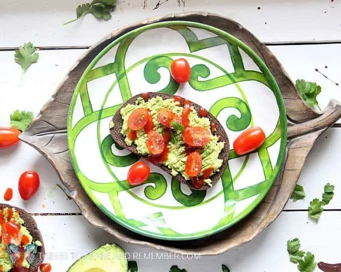 Avocado toast with roasted tomato aioli sauce makes a fabulous flavorful snack or breakfast option. Make small bite-sized toasts for party appetizers.
