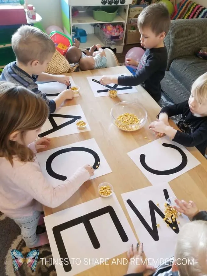 Corn Letters - grains pre-writing activity and fine motor skills with corn kernels Sensory Shape Discovery Search and Match with grains - Mother Goose Time Health and Fitness theme for February 2019 - Preschool curriculum Food Groups - Grains activities #MGTblogger #MGTHealthandFitness #ece #preschool #nutritiontheme