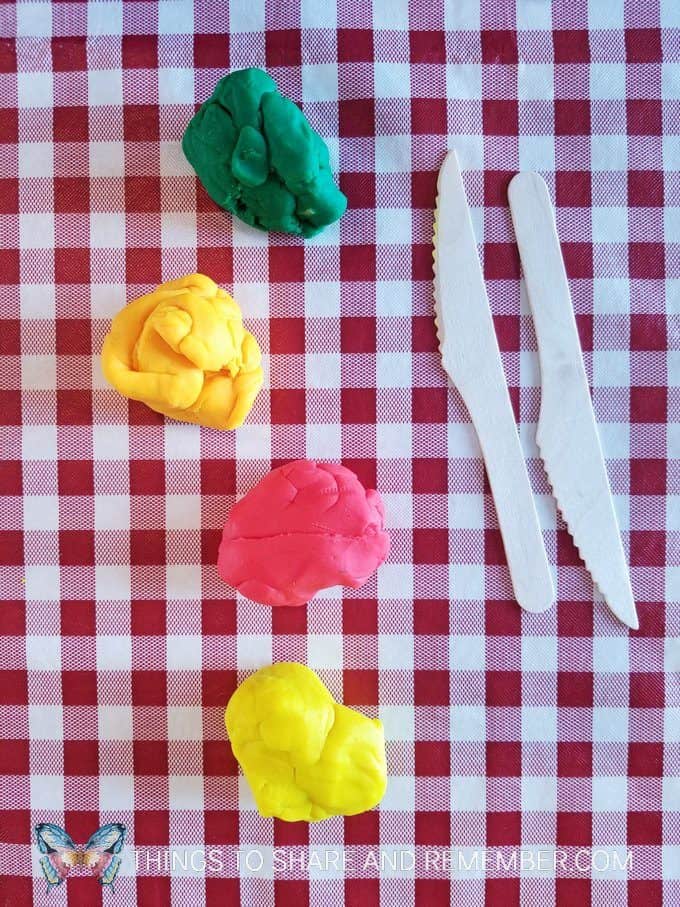 play dough and knives for Kitchen math slice and count activity with play dough