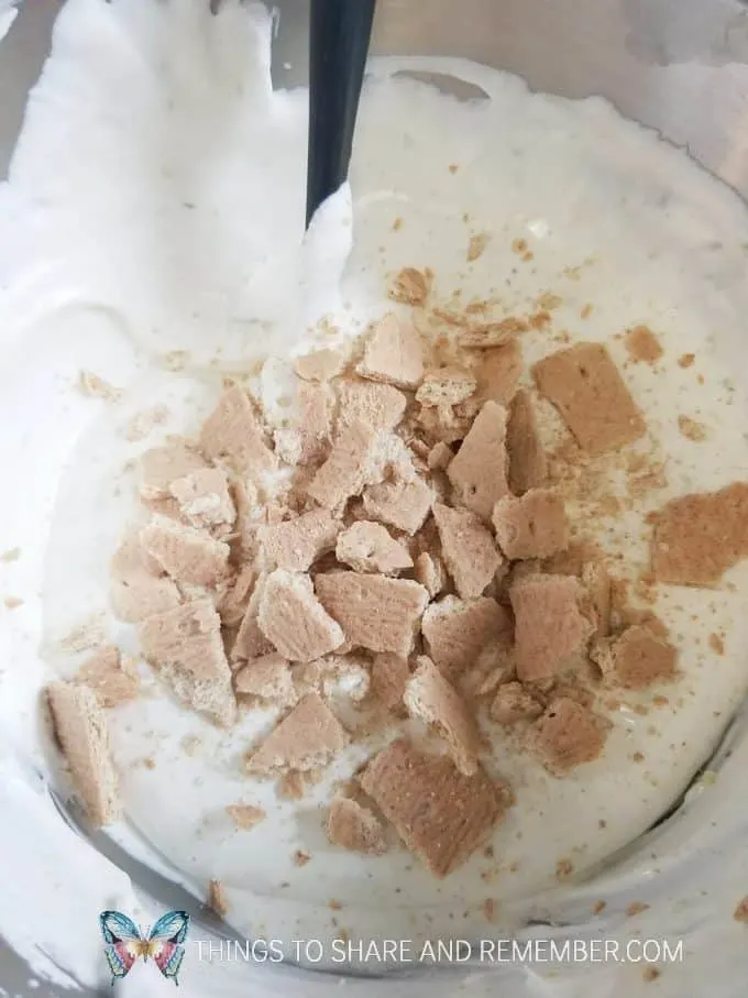 mixing in graham crackers in key lime pie ice cream