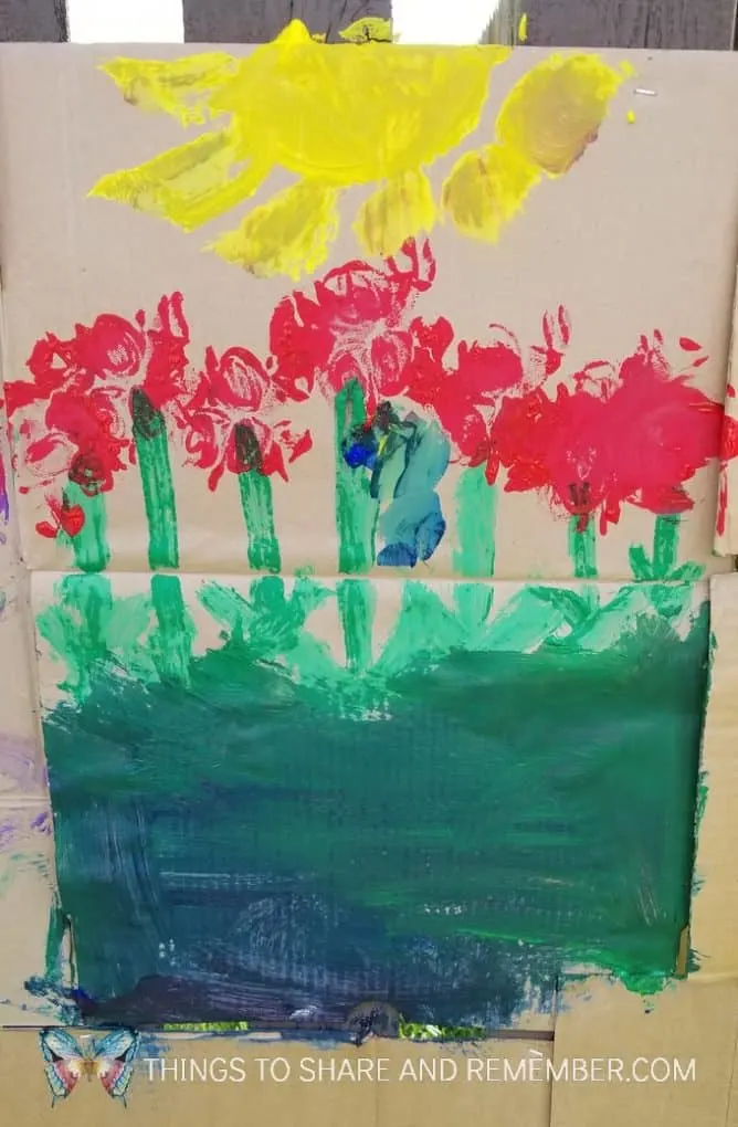flowers and sun painting on cardboard