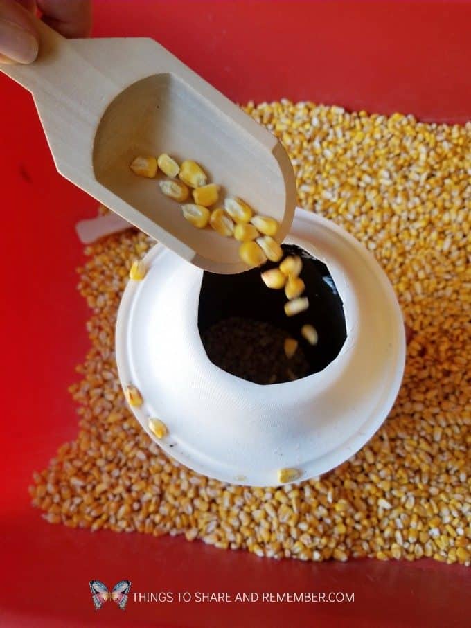 Fill the Silo Farm Sensory Bin Silo made from an oatmeal container | Experience Preschool Curriculum | Down on the Farm preschool theme 