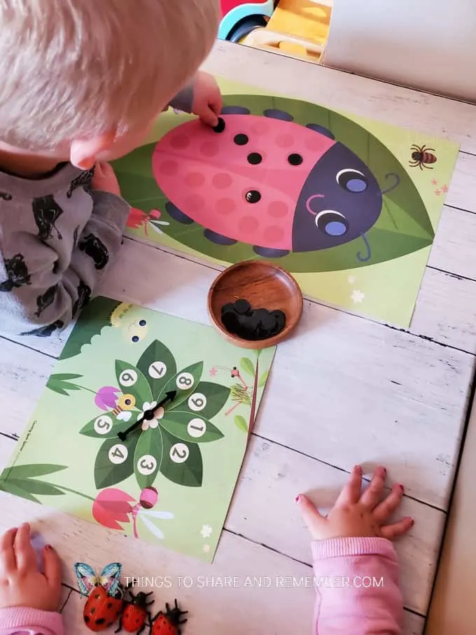 children playing ladybug counting game - painting ladybug spots activities