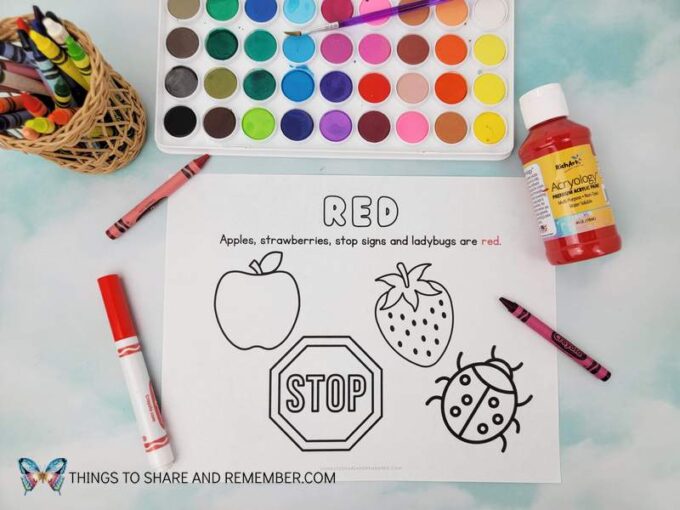 red coloring page featuring apples, strawberries, stop sign, and ladybug